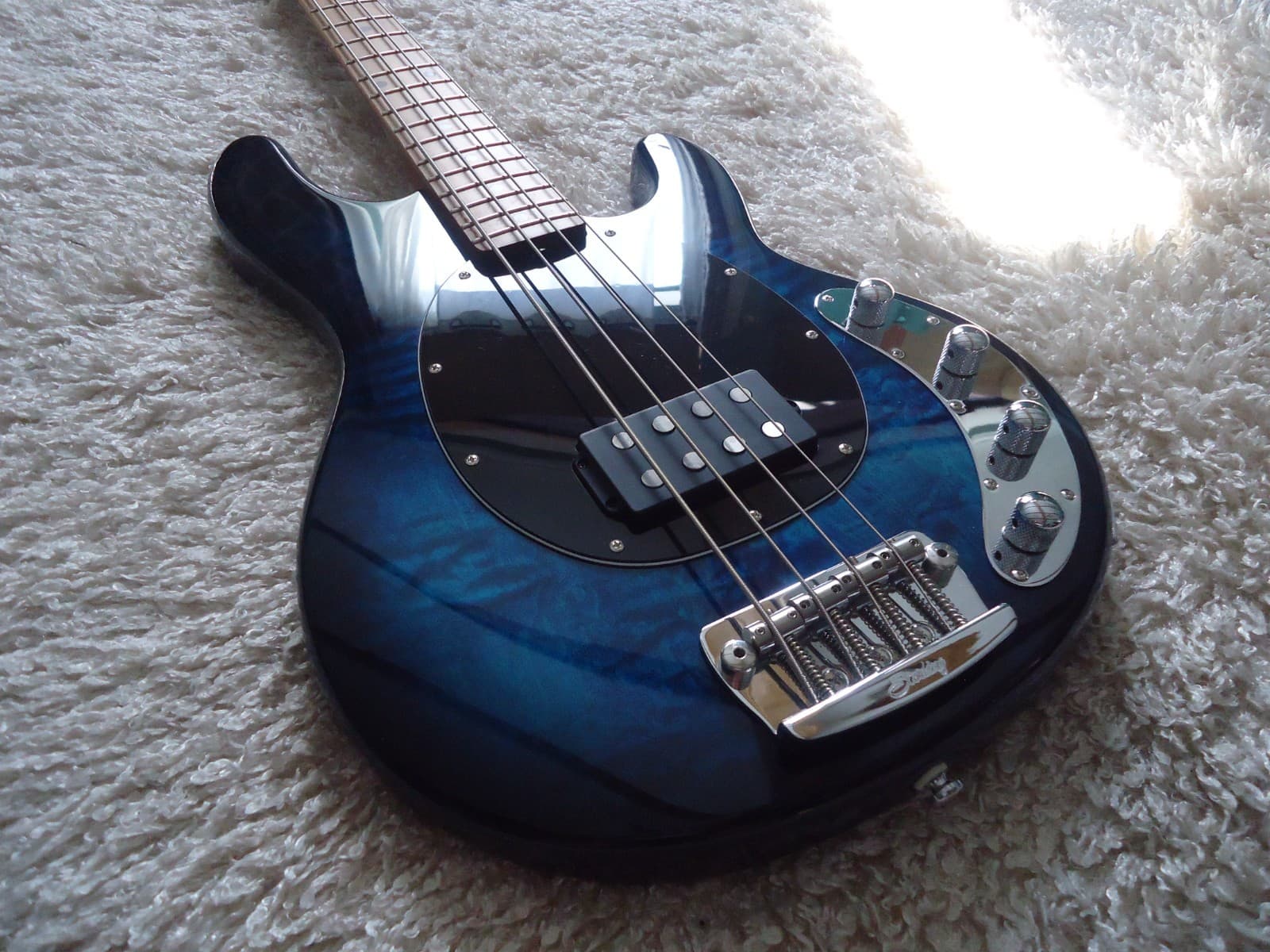 Sterling by Music Man Stingray Ray34 Neptune Blue Flame Top Bass Guitar.