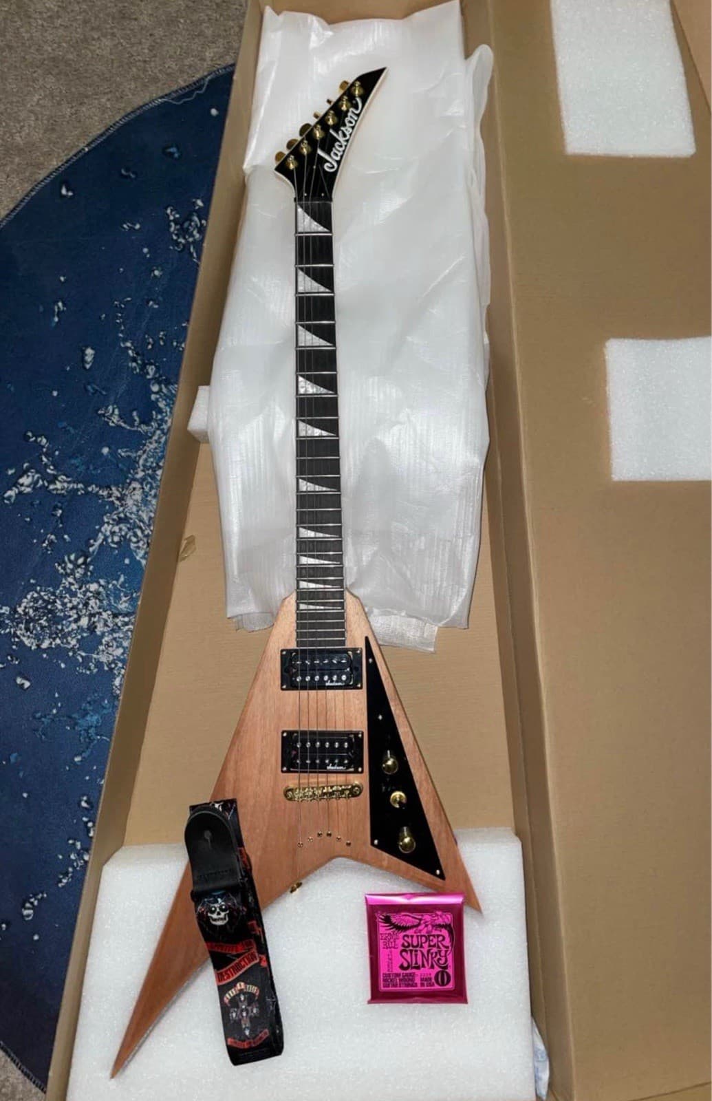 Jackson Rhoads Flying V Electric Guitar Natural Right-Handed, Strap+Strings