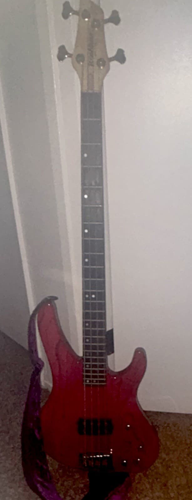 Red bass 4 string bass guitar with back stripes COMES WITH A BRAND NEW BASS AMP