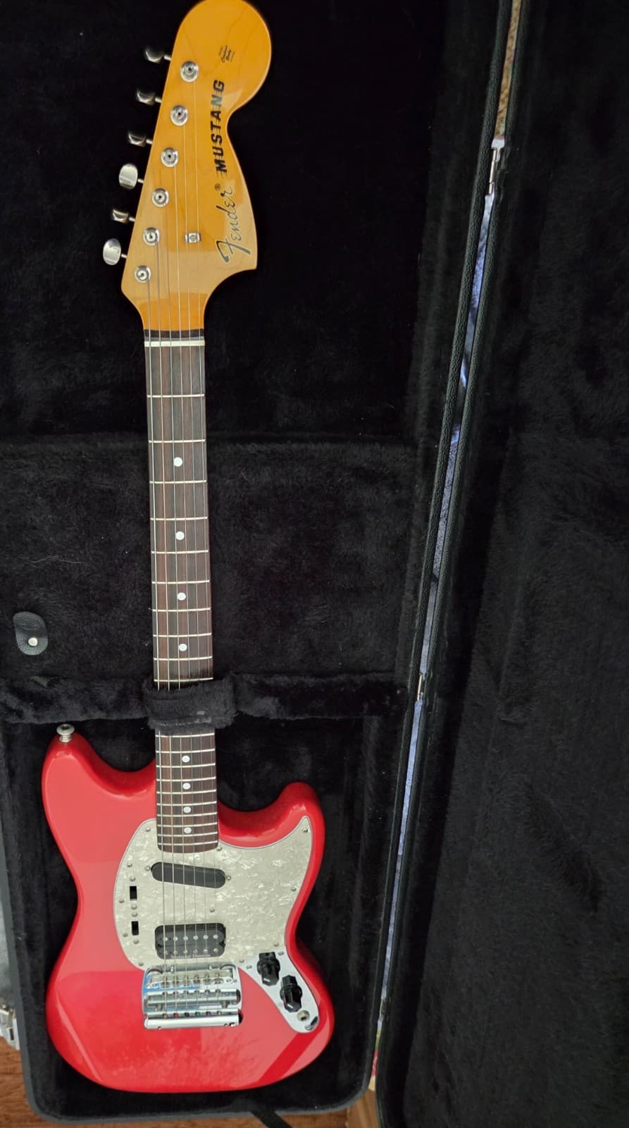fender mustang guitar in fiesta red with humbucker pickup